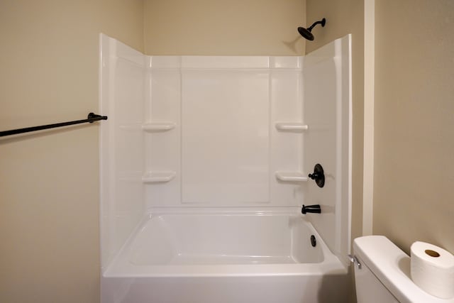 bathroom featuring  shower combination and toilet