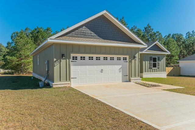 view of front facade with a front yard and a garage