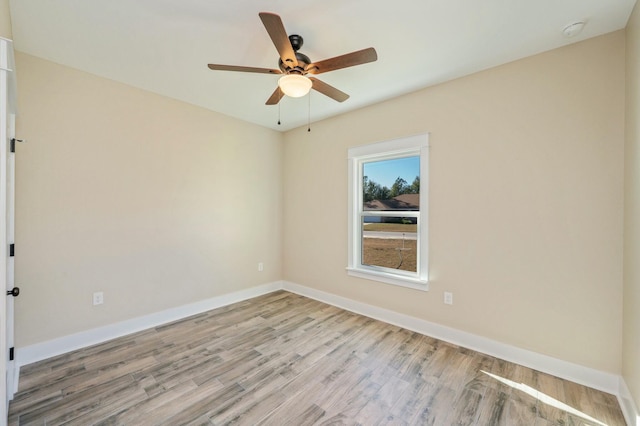 empty room with ceiling fan and light wood-type flooring