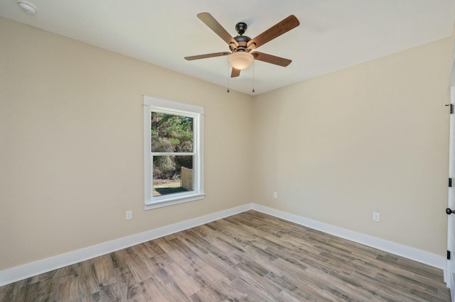 unfurnished room featuring ceiling fan and hardwood / wood-style flooring