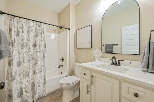 full bathroom with hardwood / wood-style flooring, vanity, toilet, and shower / bath combo with shower curtain