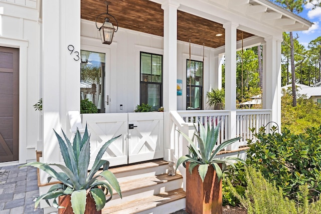 entrance to property featuring a porch