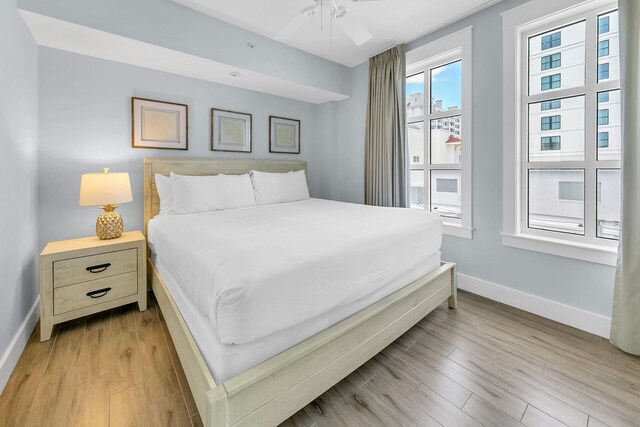 bedroom featuring light wood-type flooring and ceiling fan