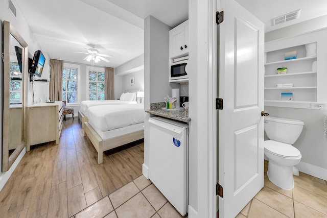 bedroom featuring ceiling fan and light hardwood / wood-style floors