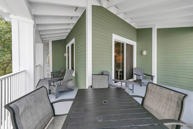 wooden deck featuring outdoor dining area