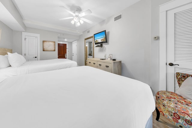 bedroom featuring ceiling fan and light hardwood / wood-style floors