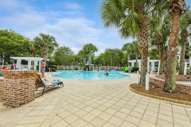 view of swimming pool featuring a patio area