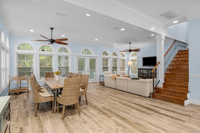 dining space with crown molding, french doors, light hardwood / wood-style flooring, and ceiling fan