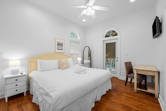 bedroom featuring ceiling fan, dark hardwood / wood-style flooring, and access to exterior