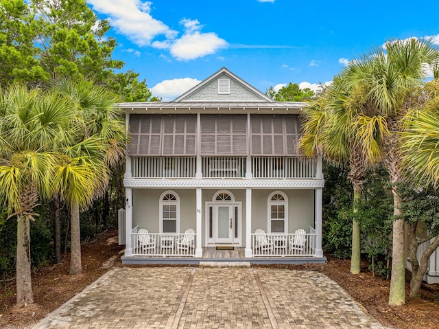 coastal home with a porch and french doors