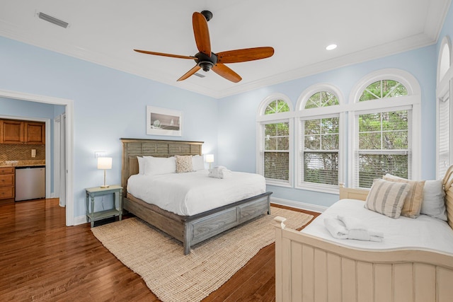 bedroom featuring ceiling fan, ornamental molding, and dark hardwood / wood-style flooring