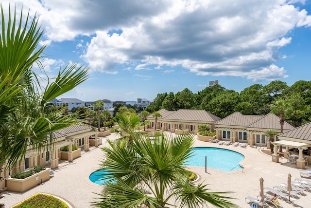 view of pool featuring a patio area