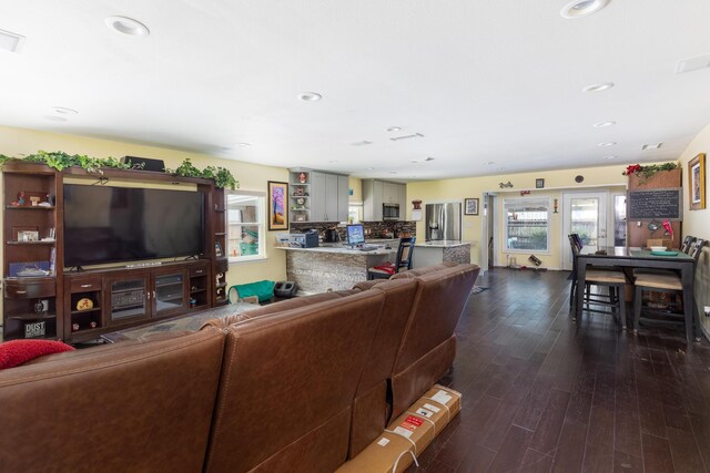 living room featuring dark hardwood / wood-style flooring