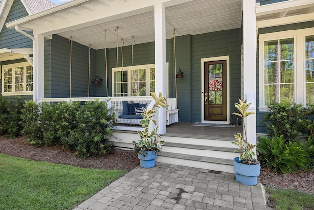 doorway to property with a porch