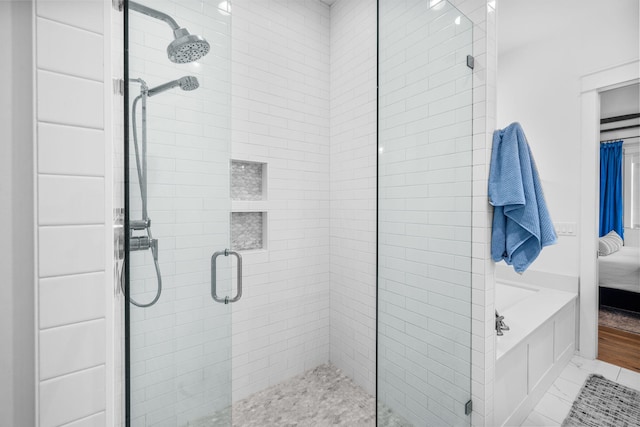 bathroom with tile patterned flooring and an enclosed shower