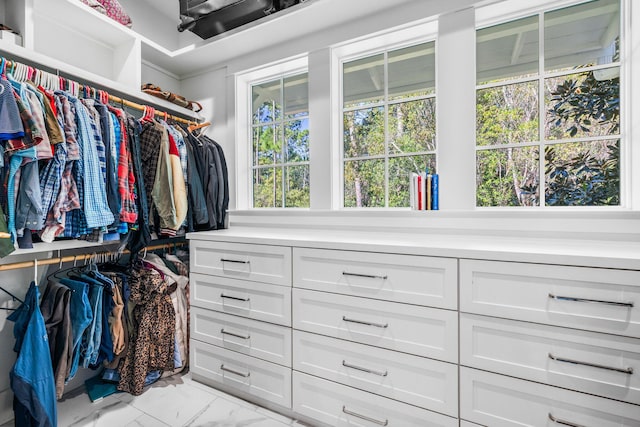 spacious closet featuring light tile patterned floors