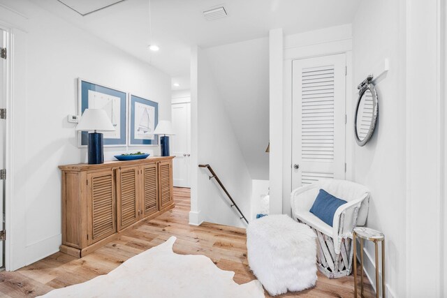 living area with light hardwood / wood-style floors