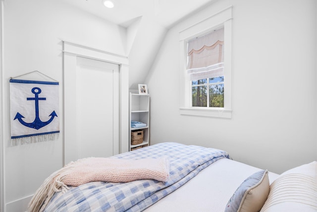 bedroom featuring lofted ceiling