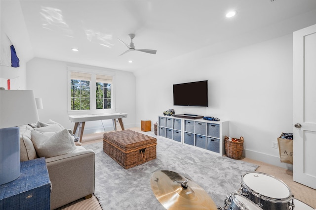 living room with ceiling fan and light carpet