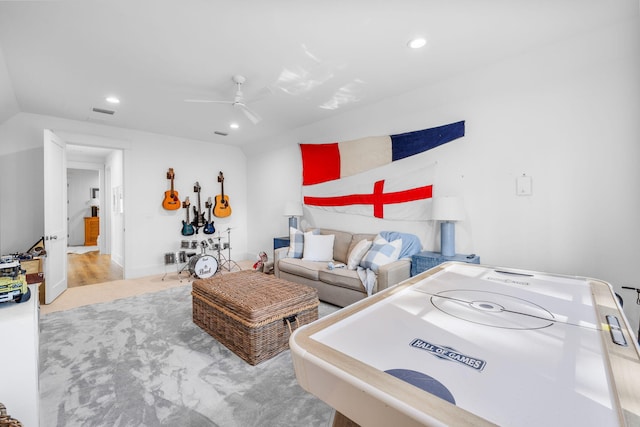 living room featuring light hardwood / wood-style flooring and ceiling fan