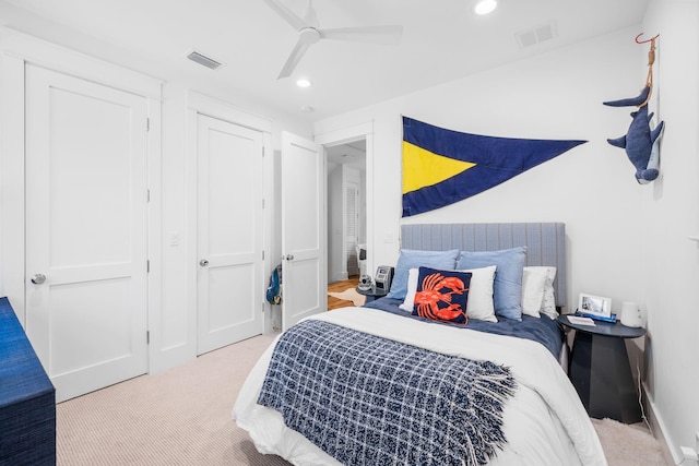 carpeted bedroom with ceiling fan