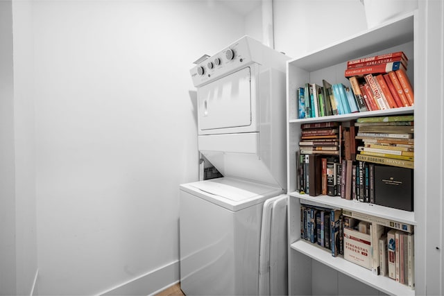 laundry area featuring stacked washer and clothes dryer