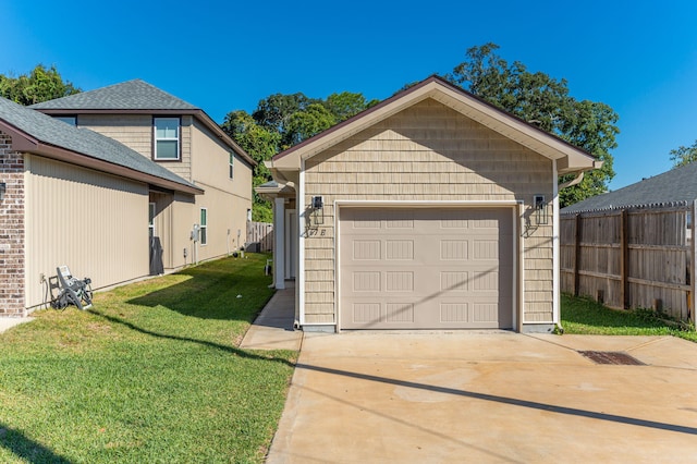 garage featuring a lawn