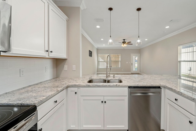 kitchen featuring appliances with stainless steel finishes, sink, ceiling fan, white cabinets, and decorative backsplash