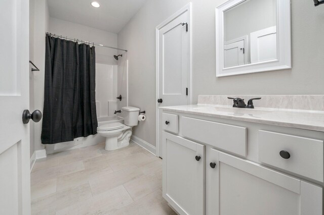 full bathroom with vanity, toilet, and shower / bath combo with shower curtain