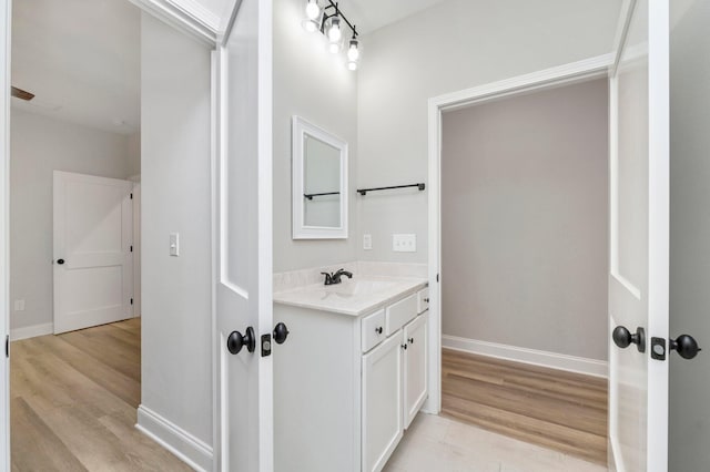 bathroom featuring vanity and hardwood / wood-style floors