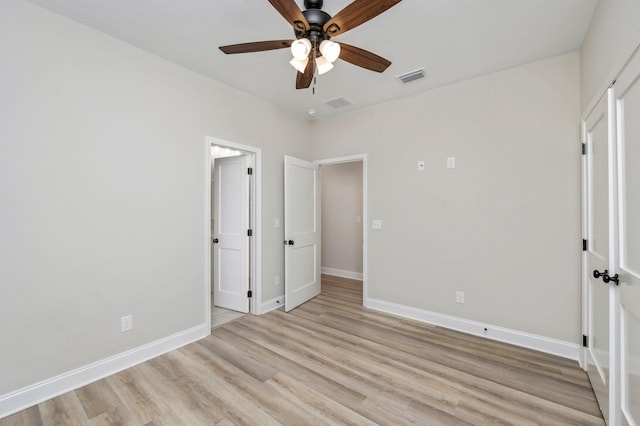 unfurnished bedroom with light hardwood / wood-style floors and ceiling fan