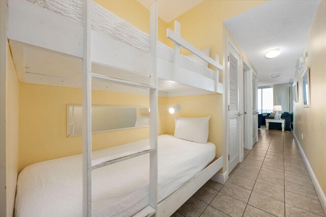 bedroom with light tile patterned flooring