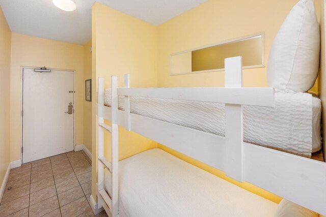 bedroom with light tile patterned flooring