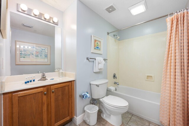 full bathroom with vanity, toilet, shower / tub combo with curtain, and tile patterned floors