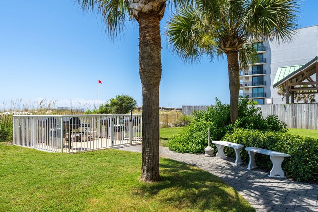 surrounding community featuring a yard and a patio area