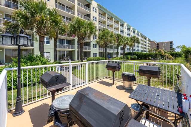 view of patio featuring a balcony