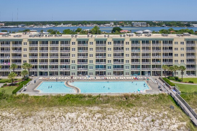 view of swimming pool with a water view