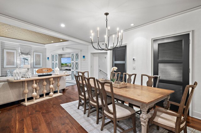 dining room featuring a chandelier and dark hardwood / wood-style floors