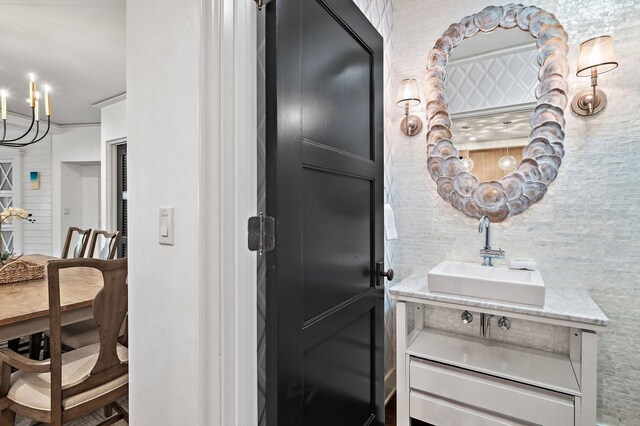 bathroom with vanity and an inviting chandelier