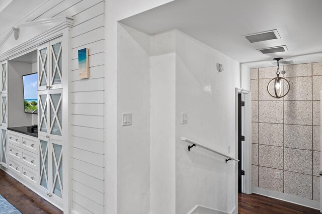 corridor featuring dark hardwood / wood-style flooring