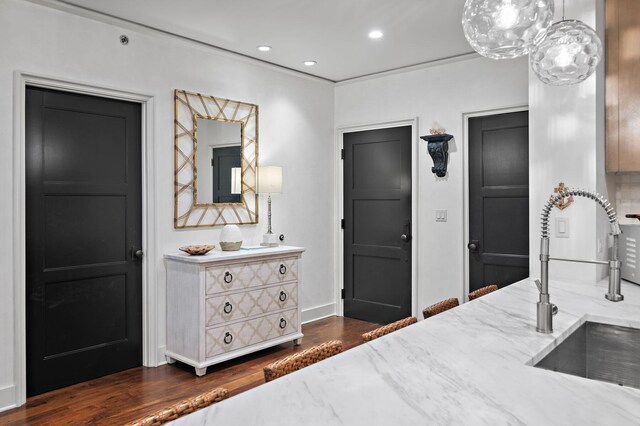 bedroom featuring dark wood-type flooring and sink