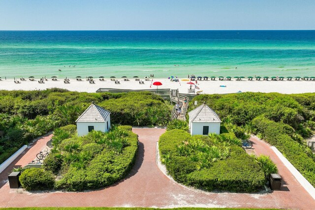 birds eye view of property featuring a view of the beach and a water view