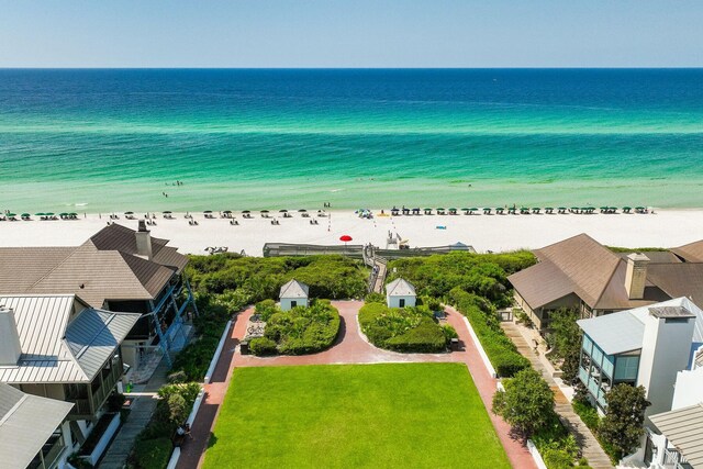 birds eye view of property featuring a view of the beach and a water view