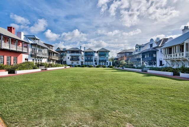 view of home's community with a yard