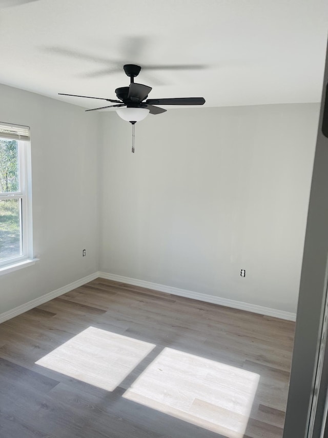 unfurnished room with ceiling fan and light hardwood / wood-style floors