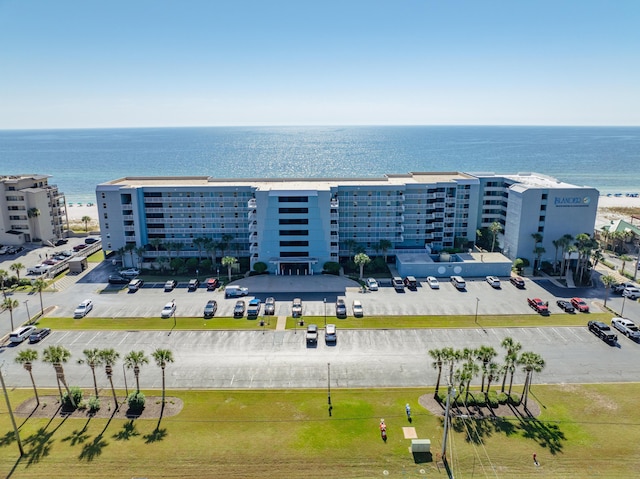 drone / aerial view of apartment complex and a large body of water