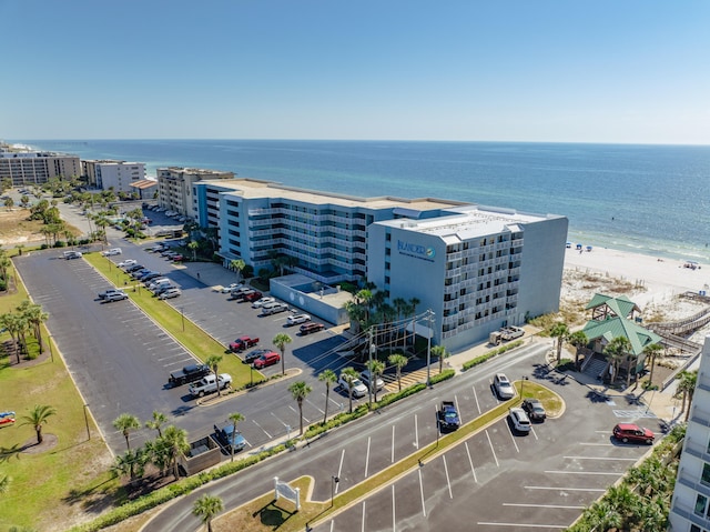 aerial view featuring a water view and a beach view