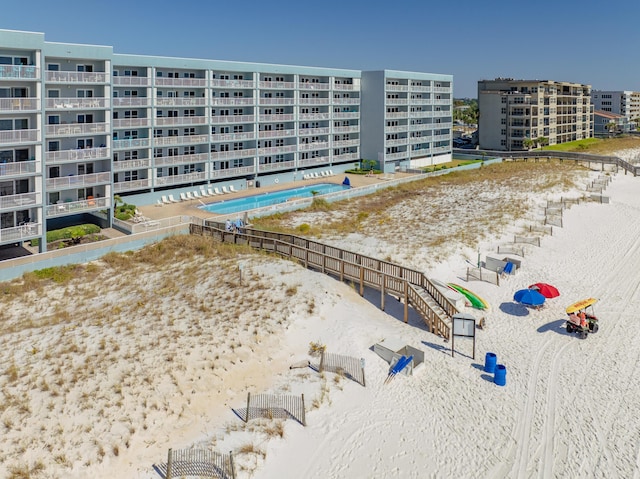aerial view of a pool and apartment complex