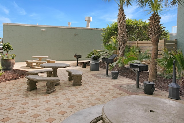 view of patio / terrace featuring fence