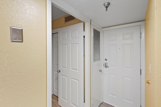 doorway to outside with hardwood / wood-style flooring